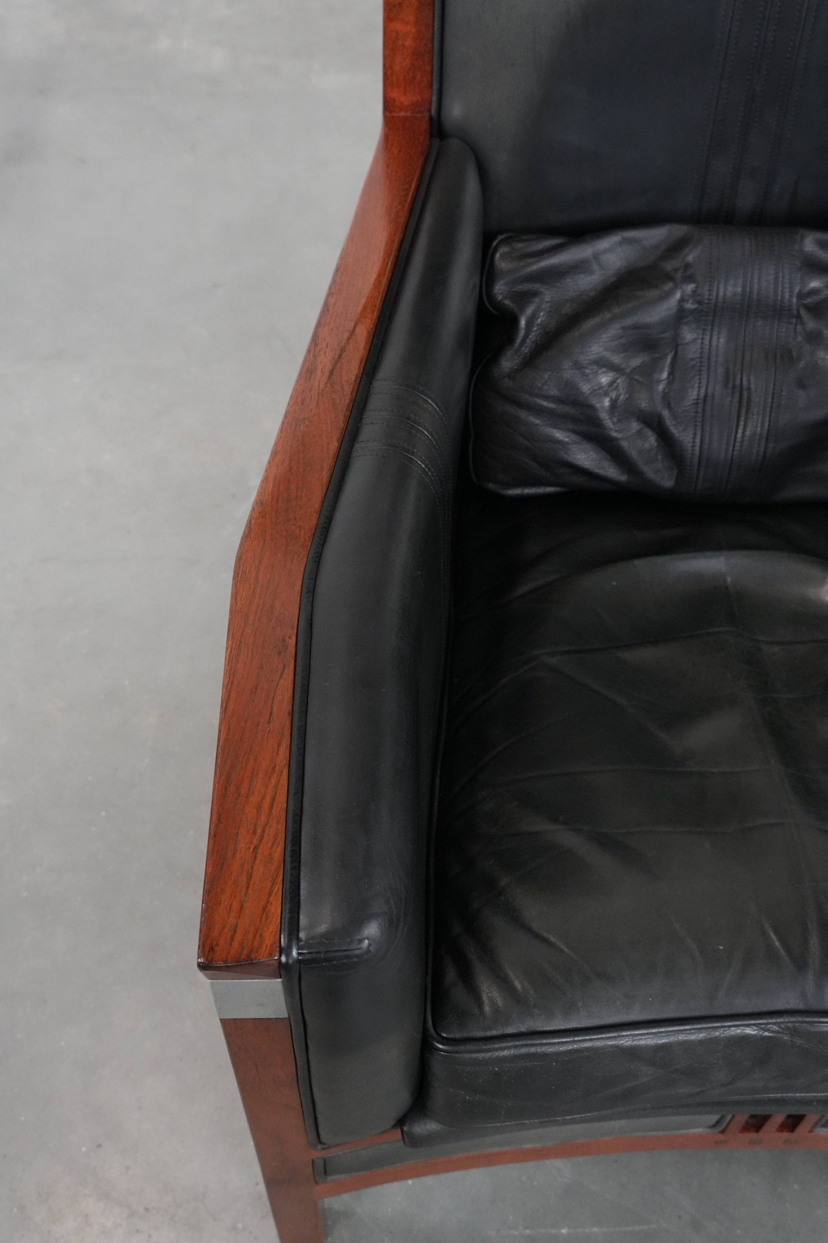 Black Art Deco cowhide leather and wooden design armchair with a high back