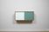 A vintage mid century wall hung bookcase/cabinet with glass sliding doors