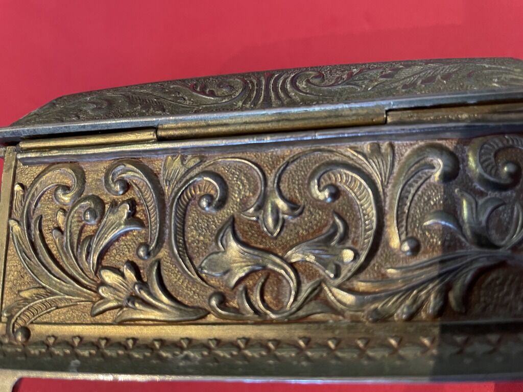 Ancient box made of chiseled metal and stone