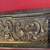 Ancient box made of chiseled metal and stone