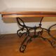 Square cherry wood table with drop leaves.