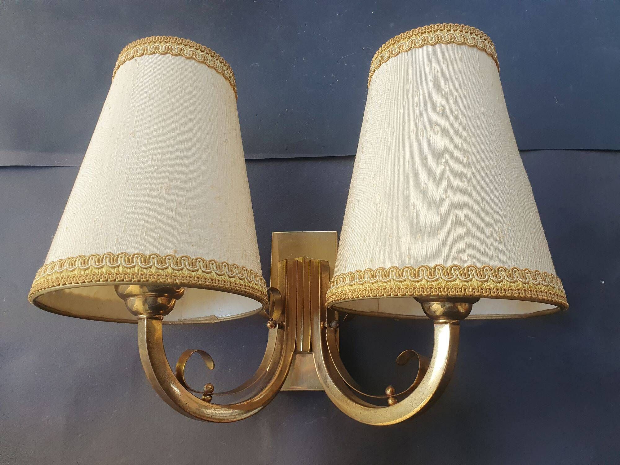 Pair of bronze wall sconces with 1940s Art Deco lampshades.
