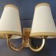 Pair of bronze wall sconces with 1940s Art Deco lampshades.