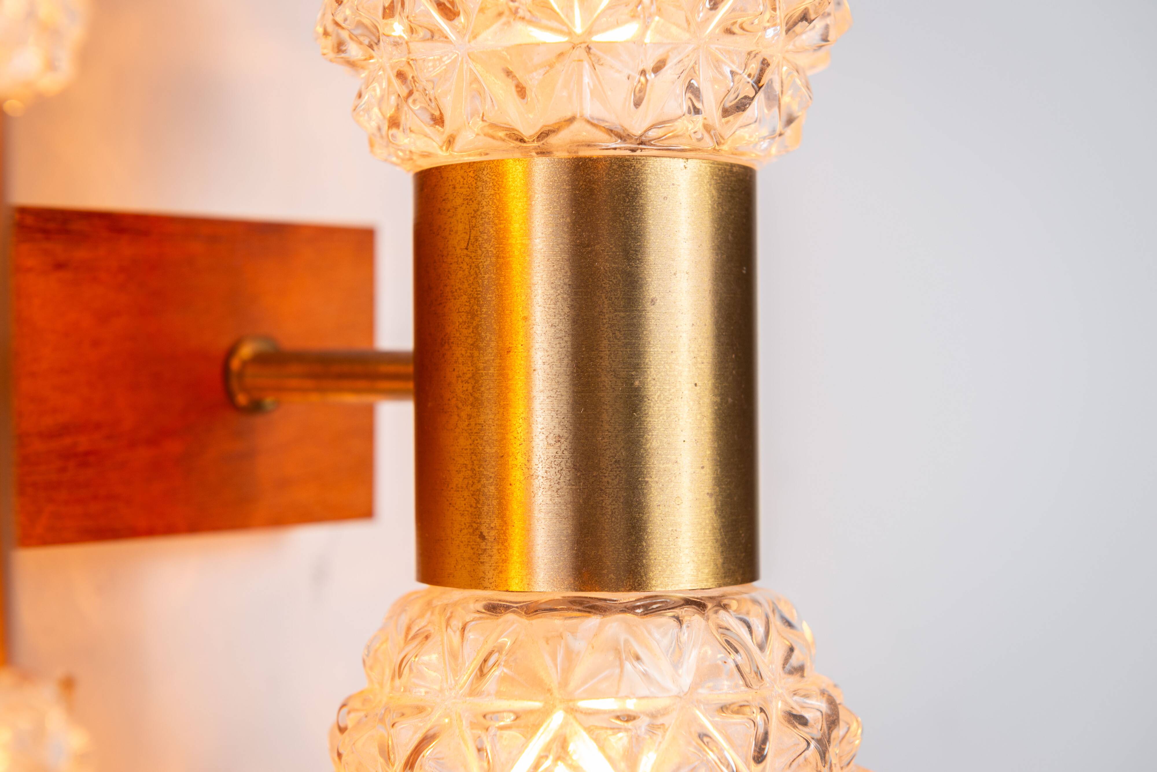 Pair of Swedish wall lamps with teak wood, brass and glass cup shade