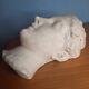 Antique plaster face of a woman