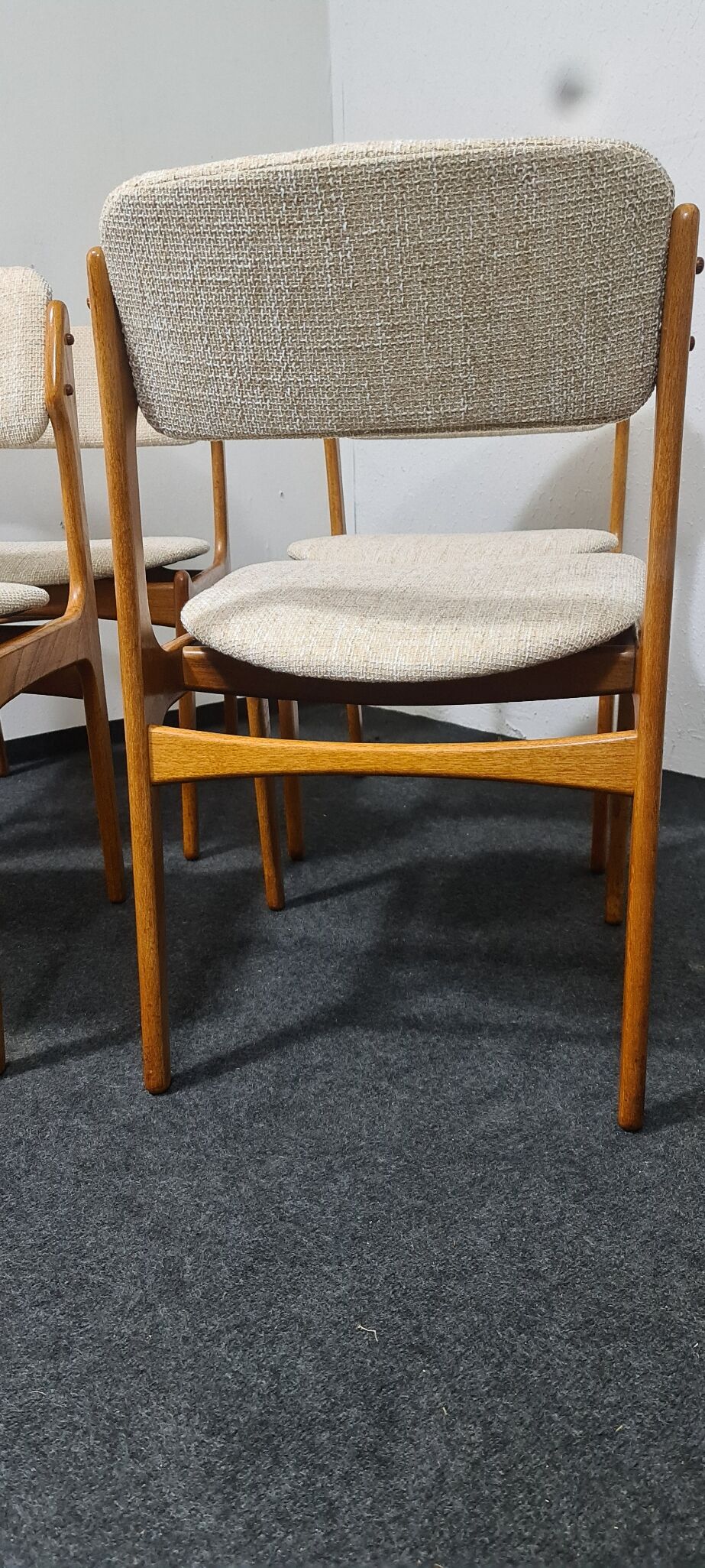 A set of four vintage teak dining chairs