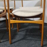 A set of four vintage teak dining chairs