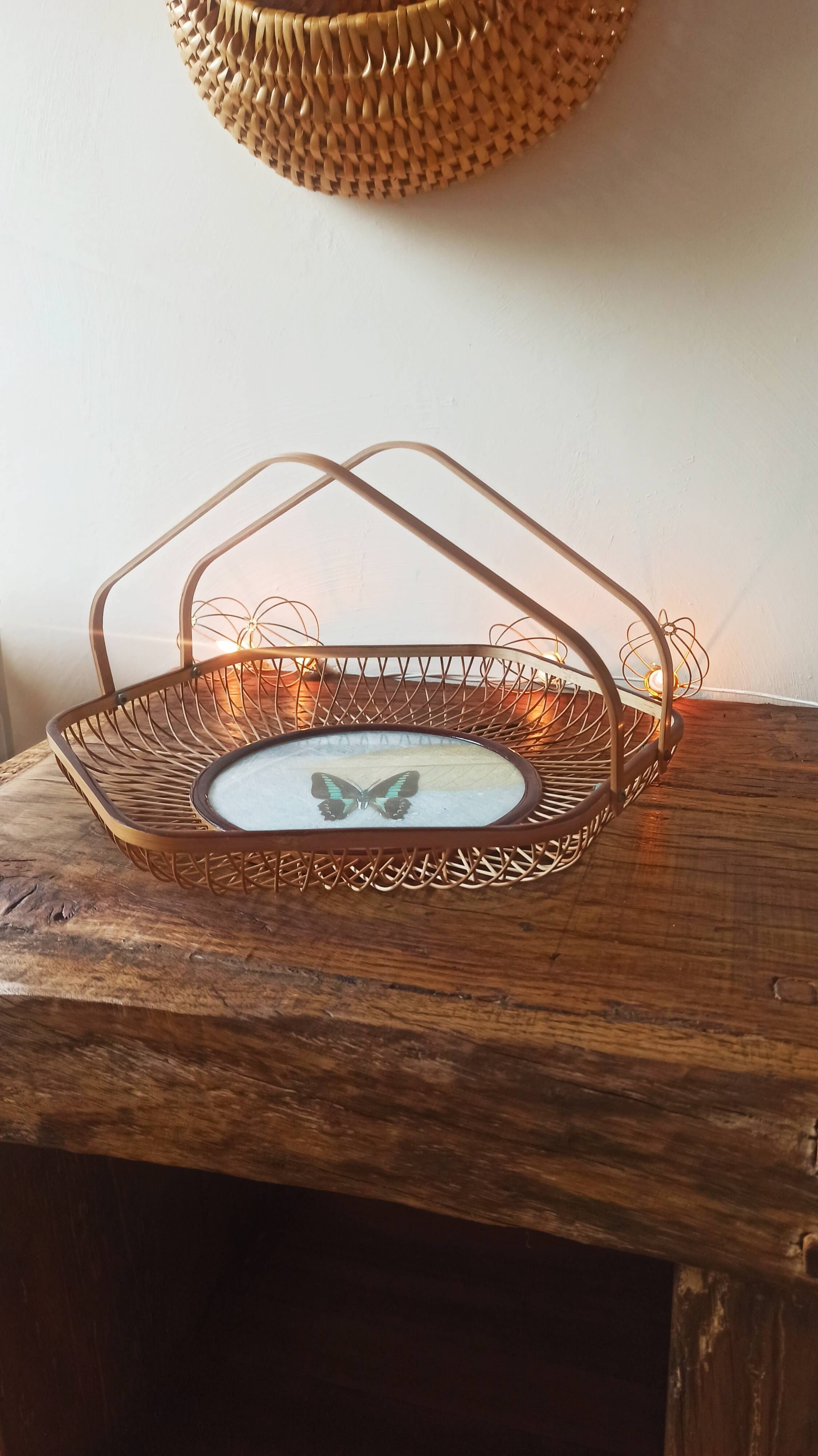 Rattan basket/tray/coin tray with a collection butterfly.