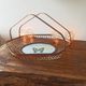 Rattan basket/tray/coin tray with a collection butterfly.