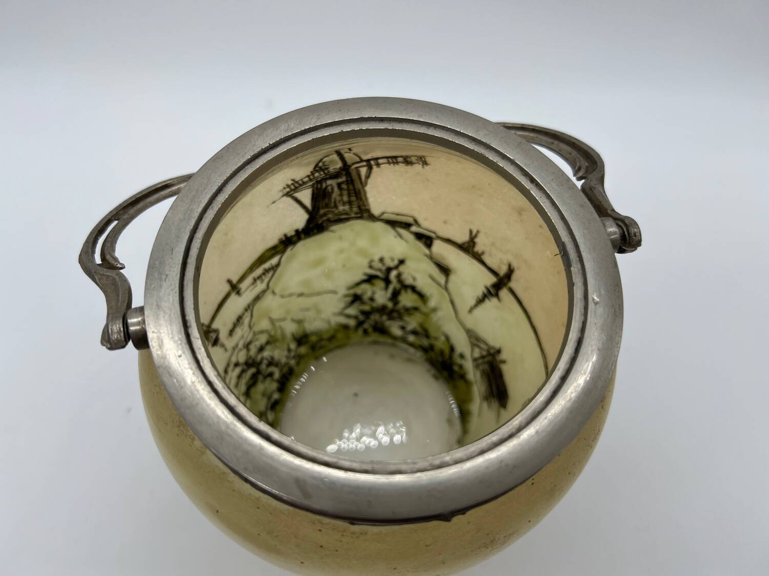 Old enameled glass cookie jar with mill decor