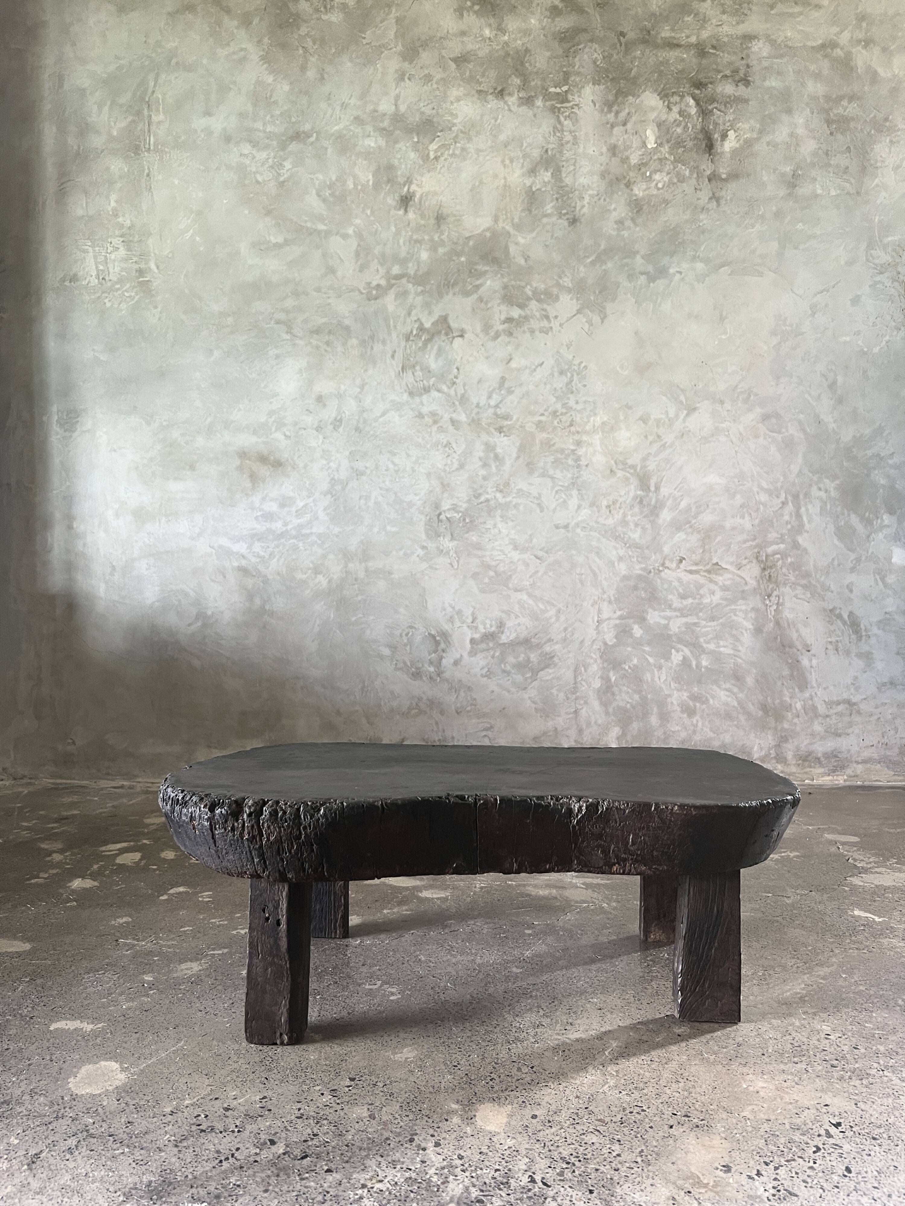Small old Asian wooden coffee table in Japanese style, kidney-shaped top