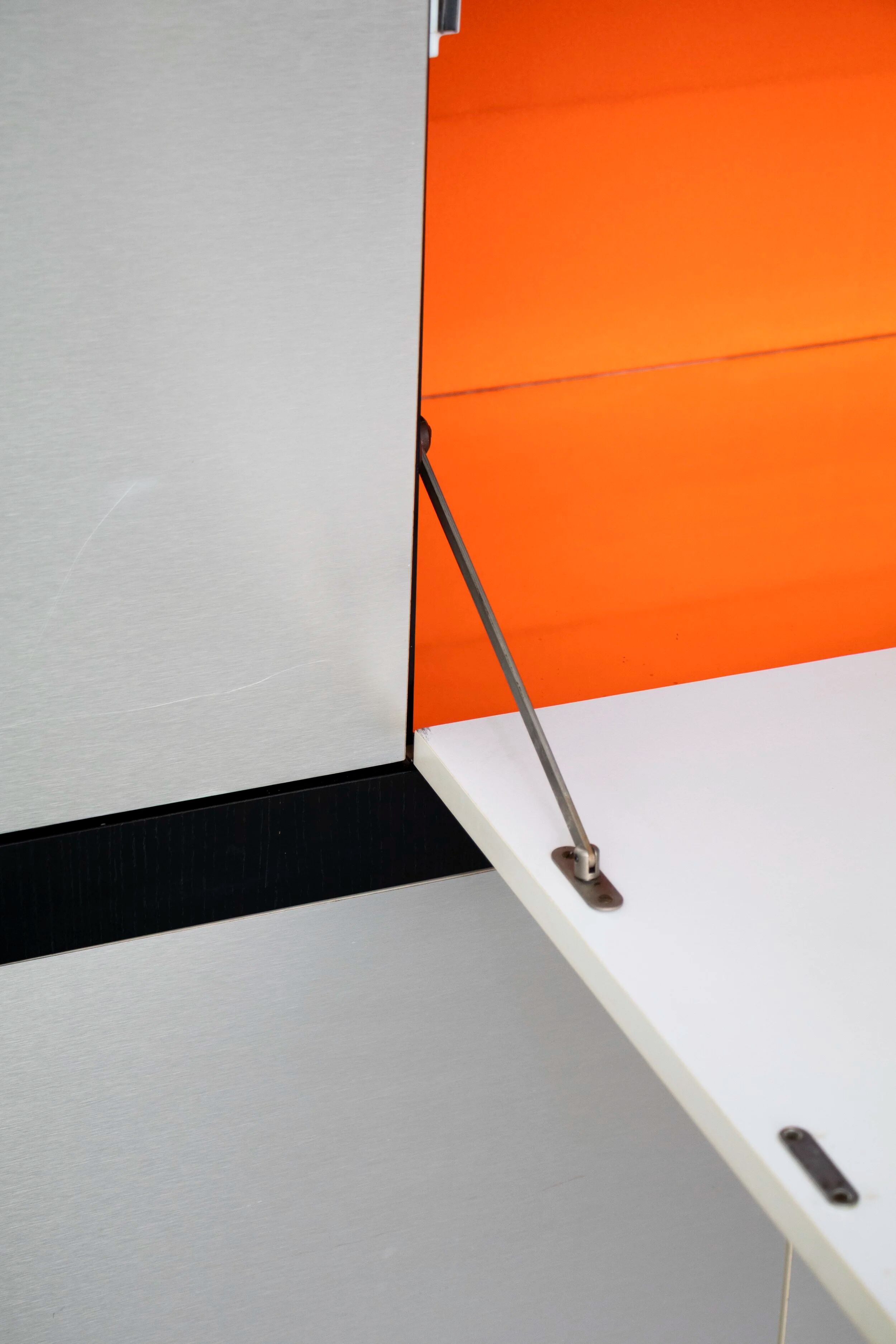 Brushed metal bar cabinet by De Coene