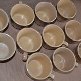 11 St Amand glazed stoneware cups and saucers/sugar bowl/milk jug