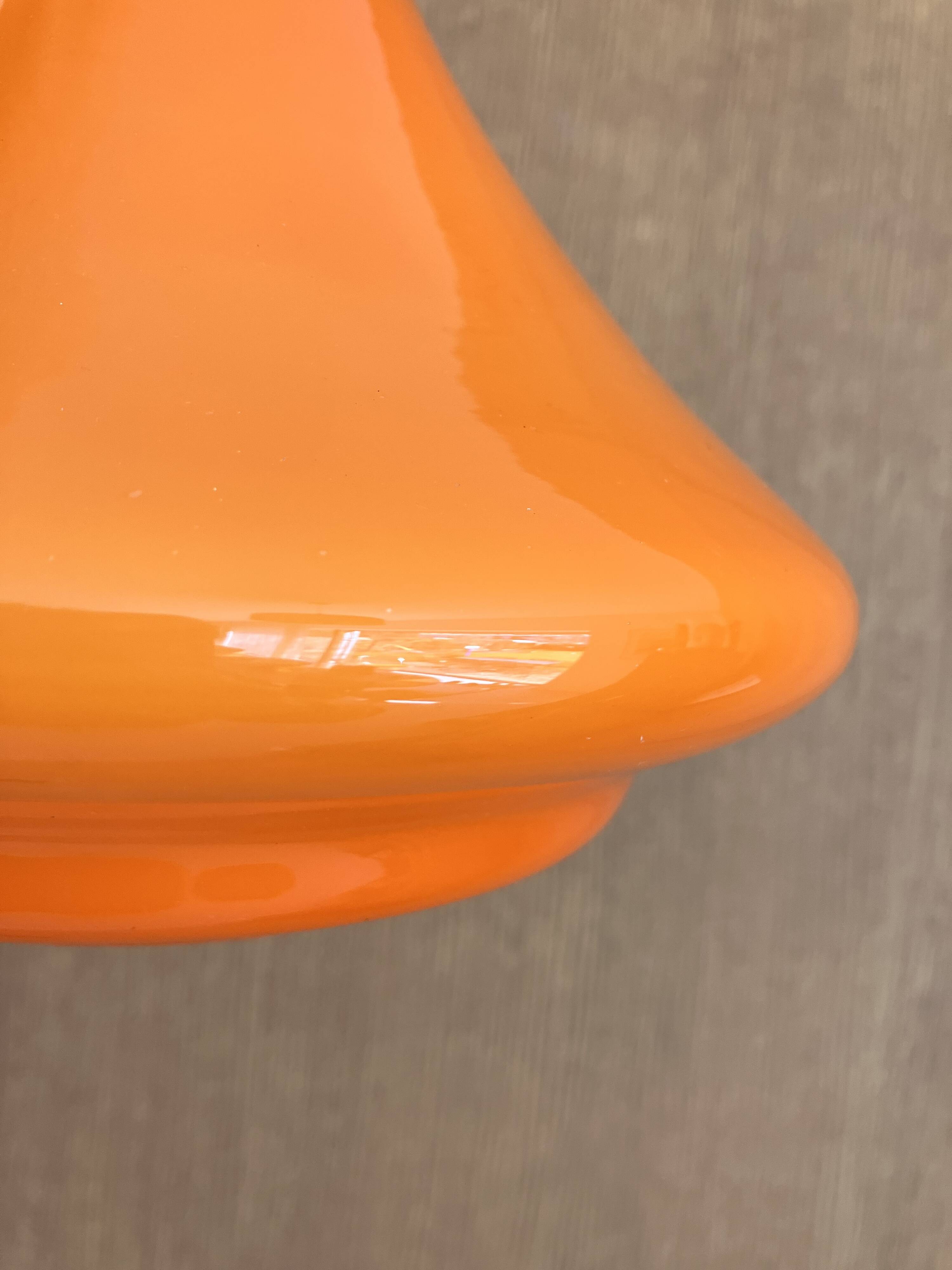 Set of three orange opaline suspensions from the 1970s Space Age.
