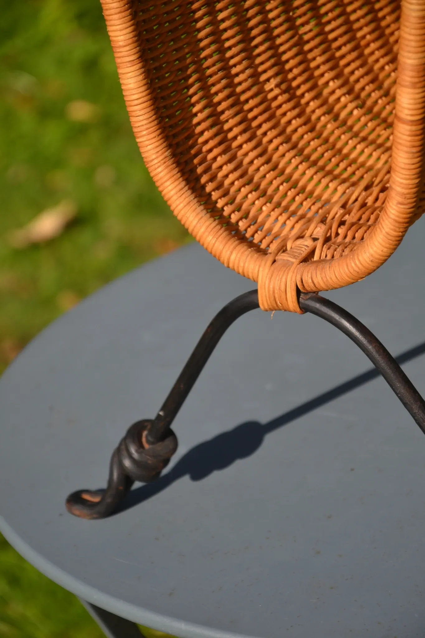 Wrought iron and rattan magazine/newspaper rack