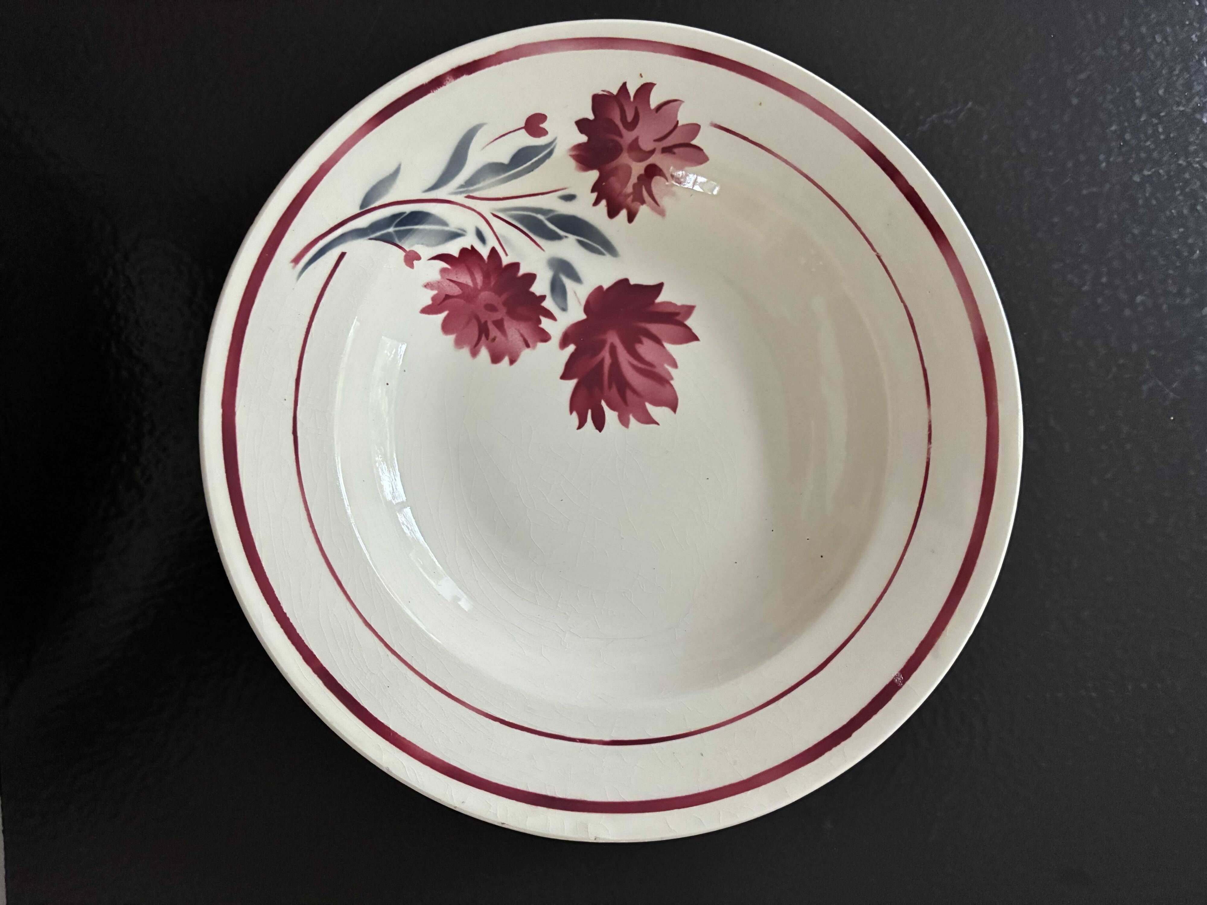 Set of 2 antique deep plates with red flower pattern.