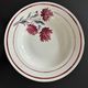 Set of 2 antique deep plates with red flower pattern.