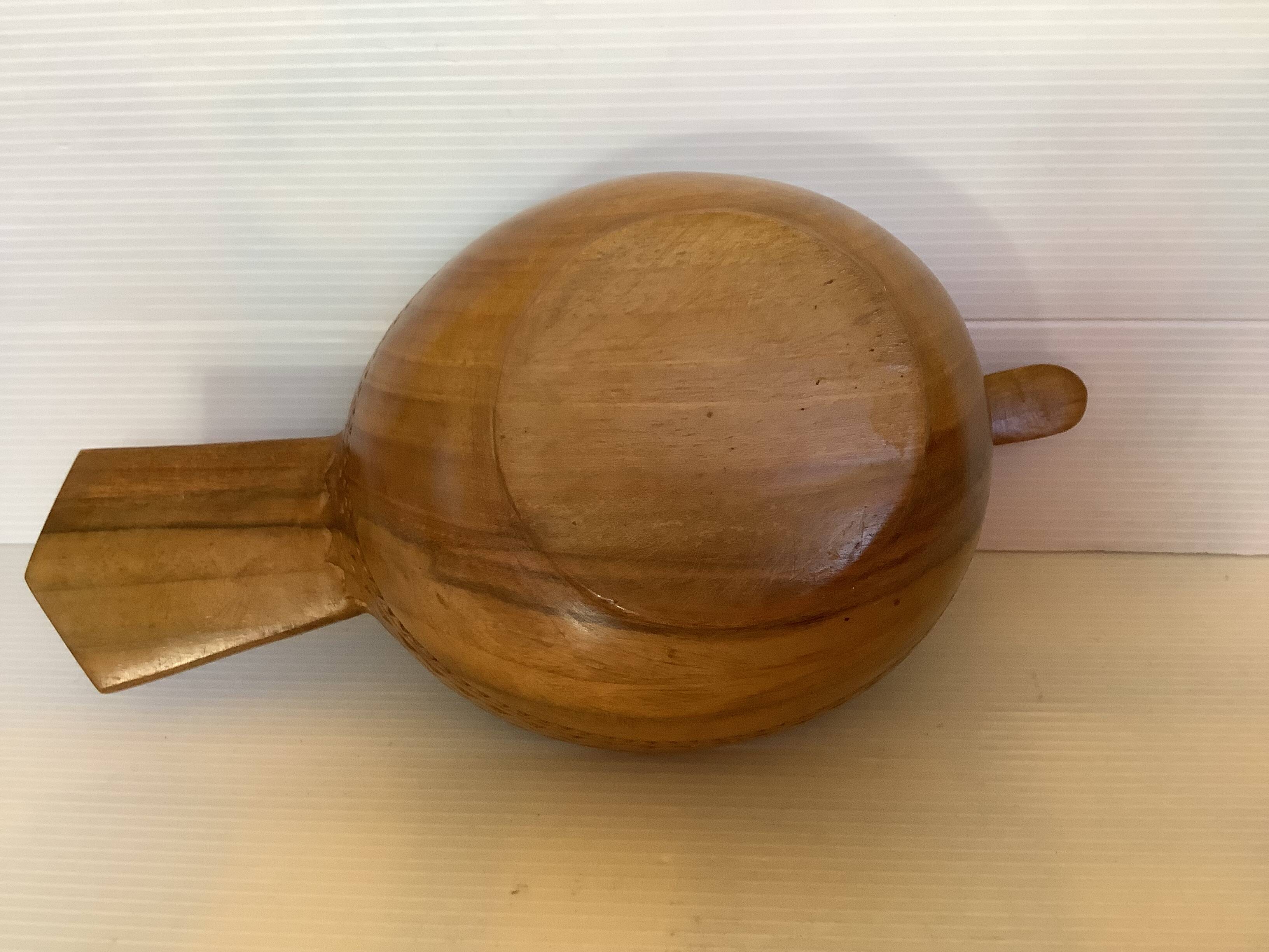 Carved wooden bird pocket