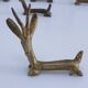 eight vintage brass Gazelle knife rests