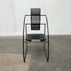 Postmodern black Quinta chair in perforated metal by Mario Botta for Alias, 1980s.