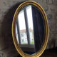 Oval mirror in gilded wood 67X52