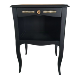 Black bedside table and raw wood