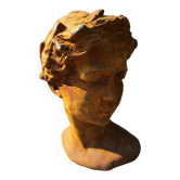 Cast iron sculpture of a woman.