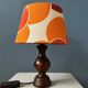 Vintage Space Age table lamp with orange fabric shade.