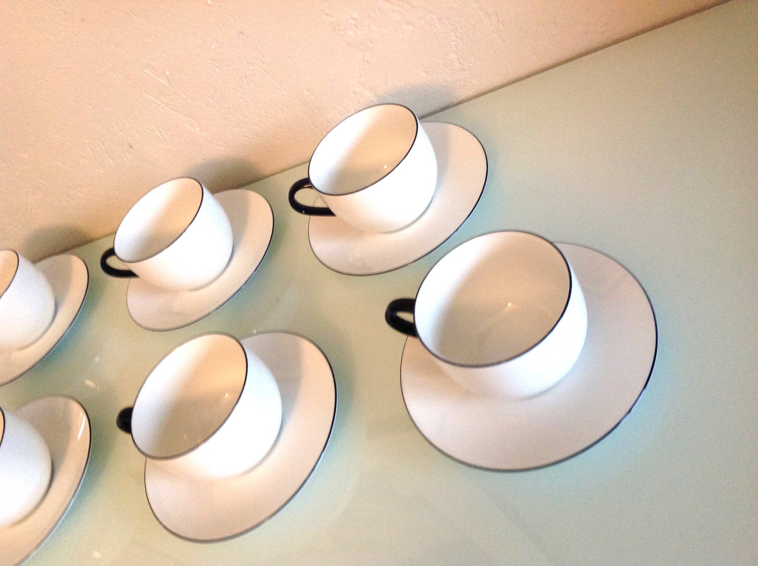 Set of eight white porcelain cups with blue edging / vintage 70s-80s