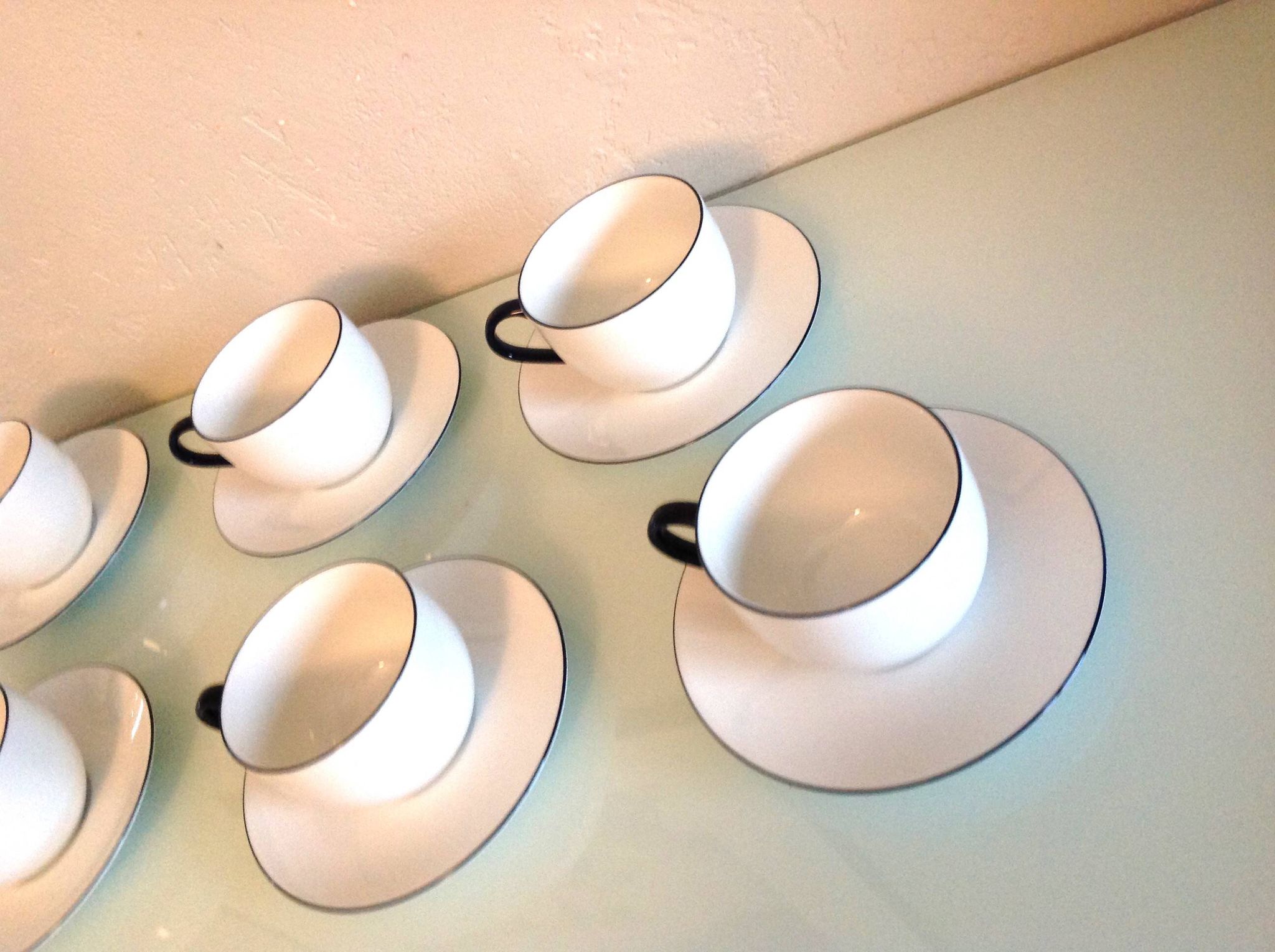 Set of eight white porcelain cups with blue edging / vintage 70s-80s