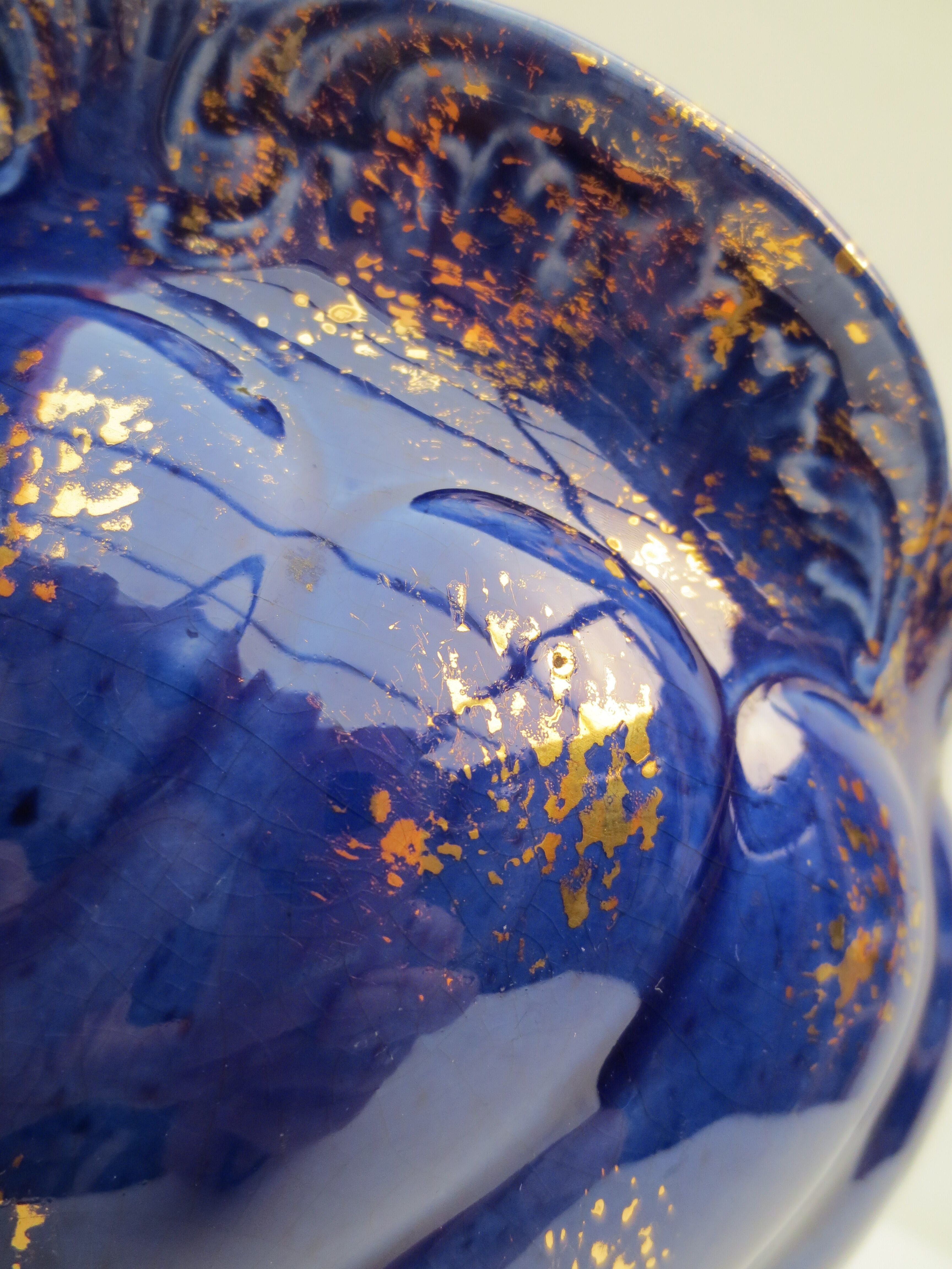 Pair of cache-old pots in midnight blue and gold ceramic