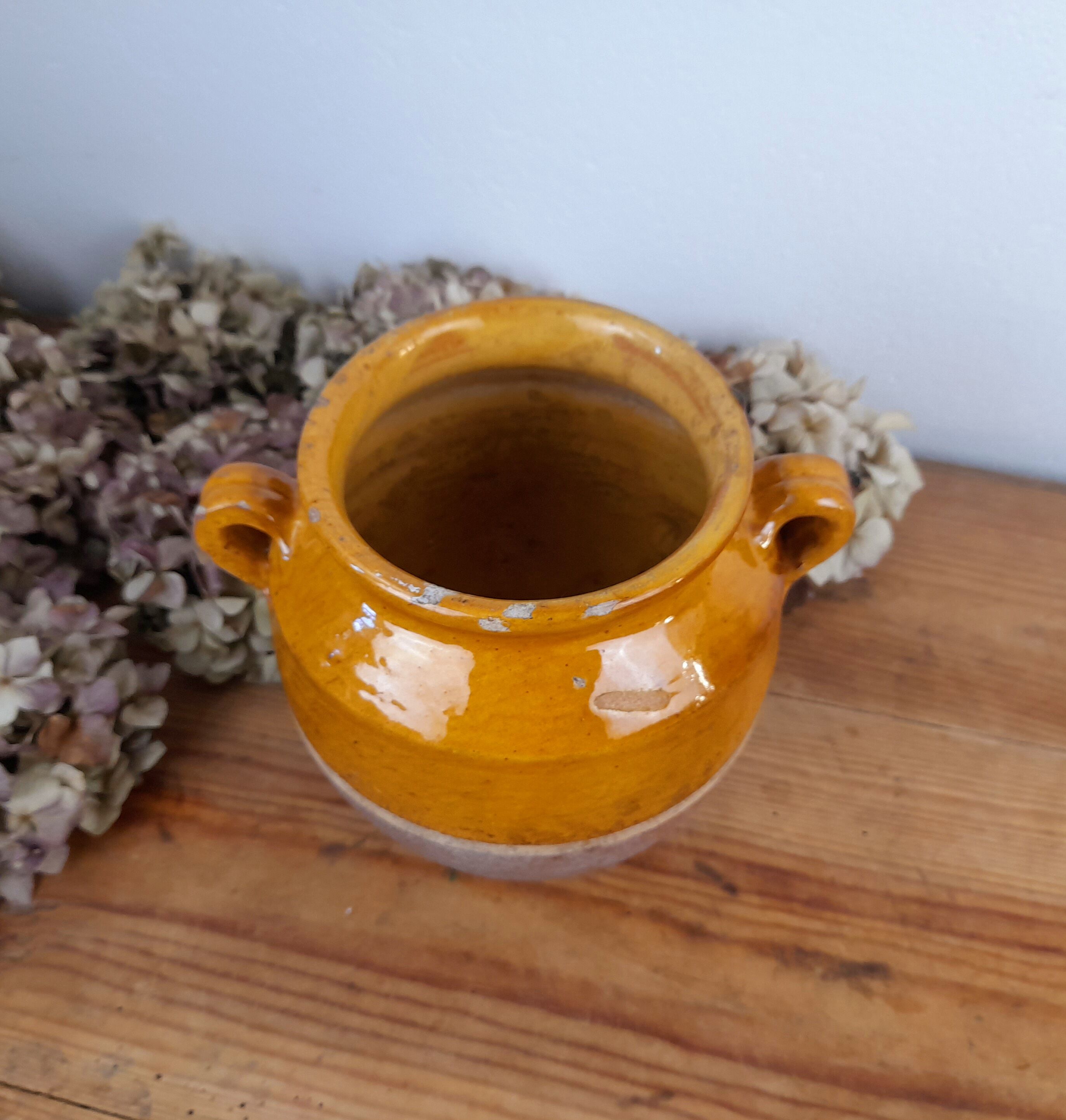 Old glazed terracotta grease pot