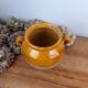 Old glazed terracotta grease pot