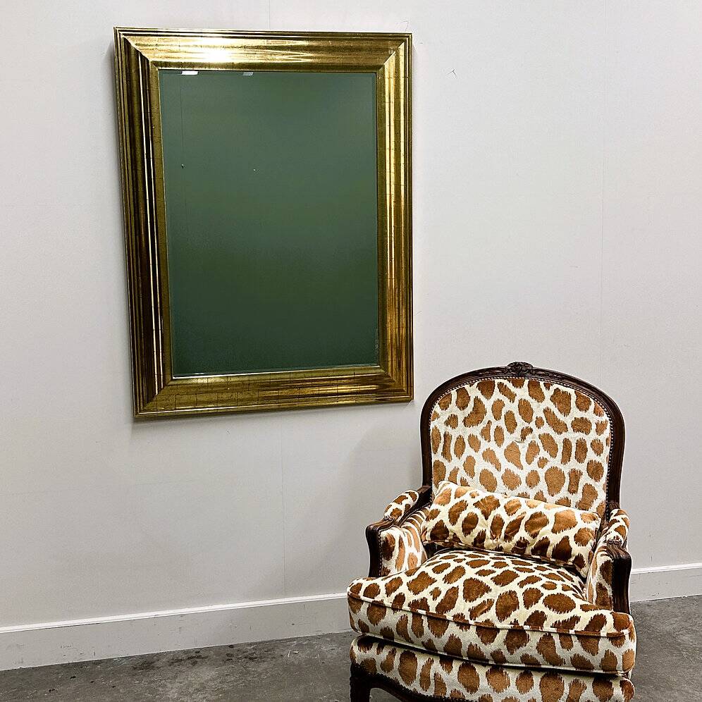 Very large Deknudt mirror with faux gold leaf frame, 1980s. Belgium