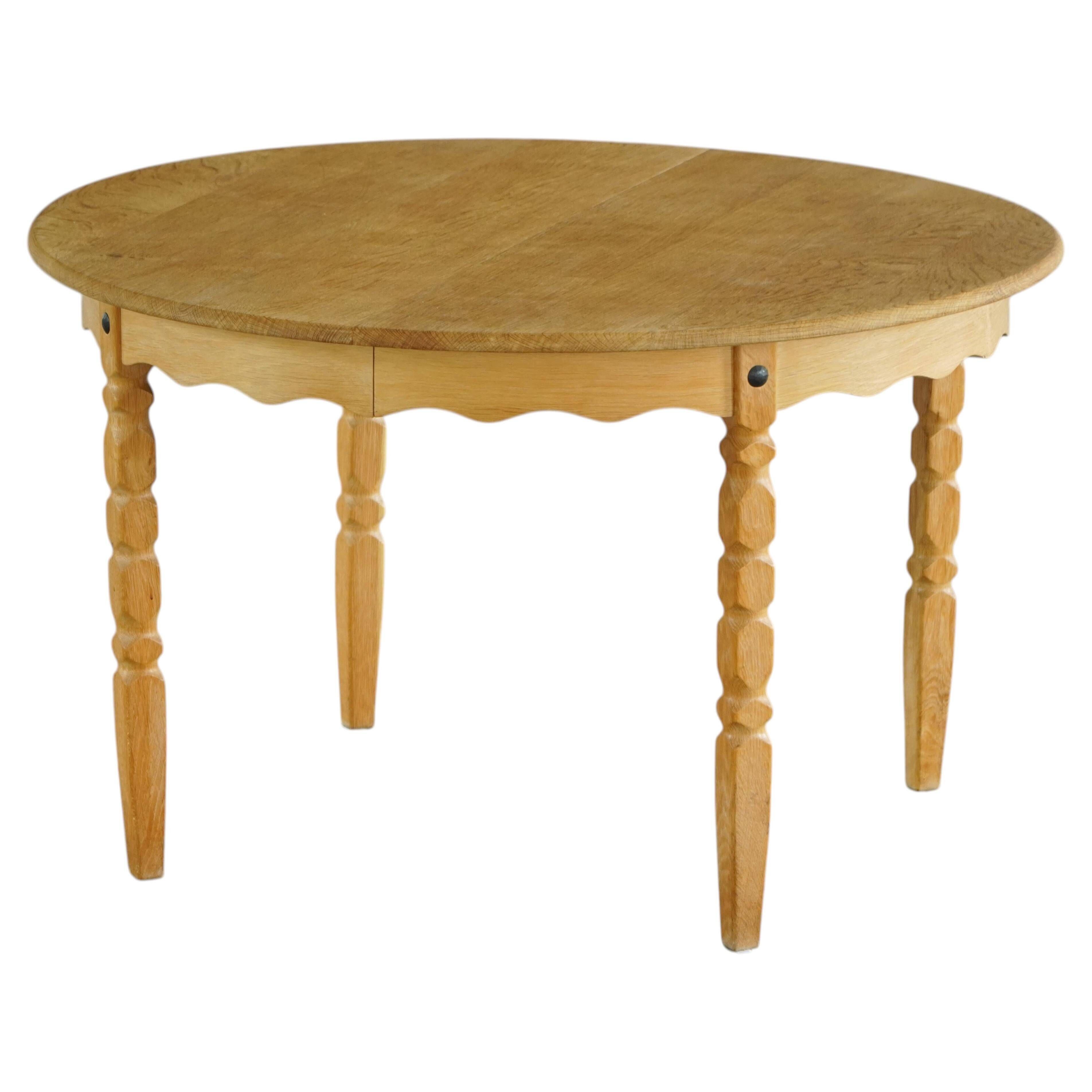 Round solid oak dining table with three extensions, mid-century Danish style, 1960s.