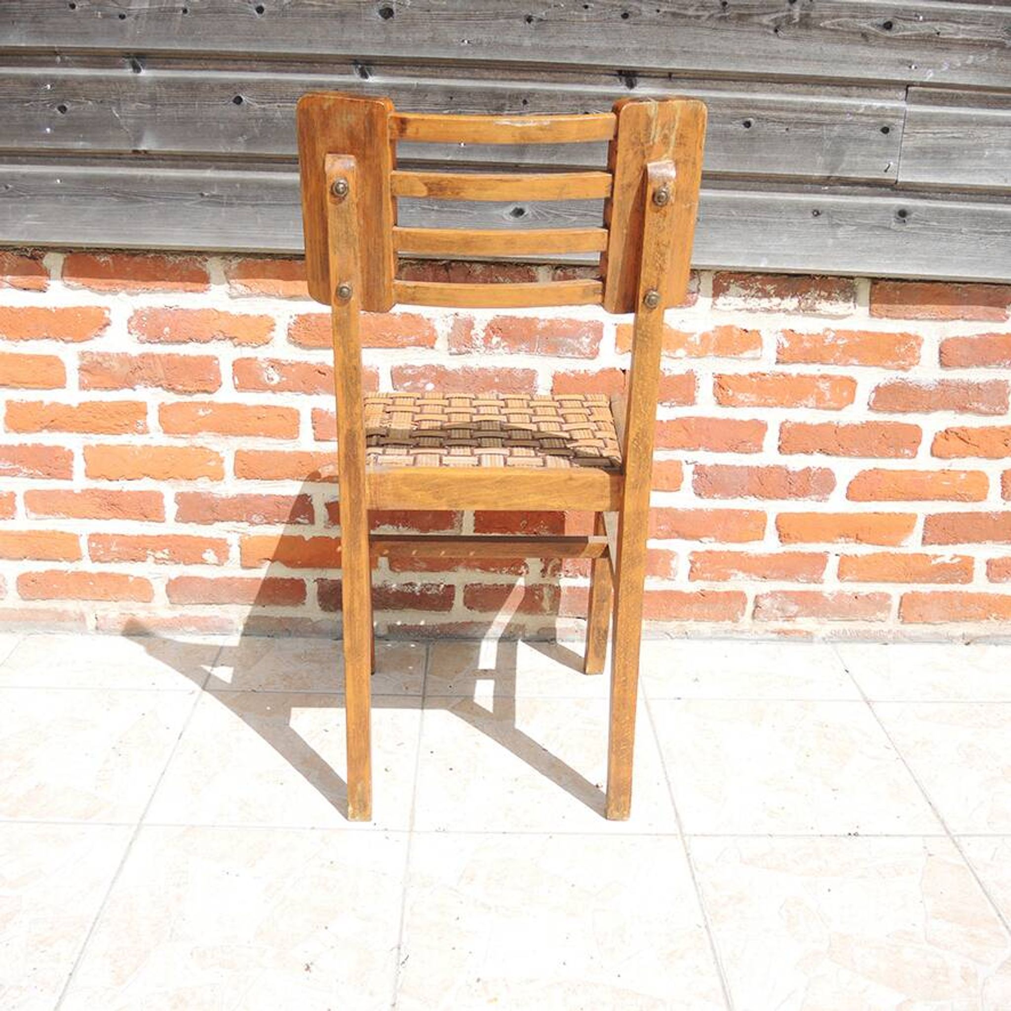 Old wooden chair in the style of Pierre Cruège.