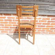 Old wooden chair in the style of Pierre Cruège.