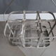 Antique metal bottle holder