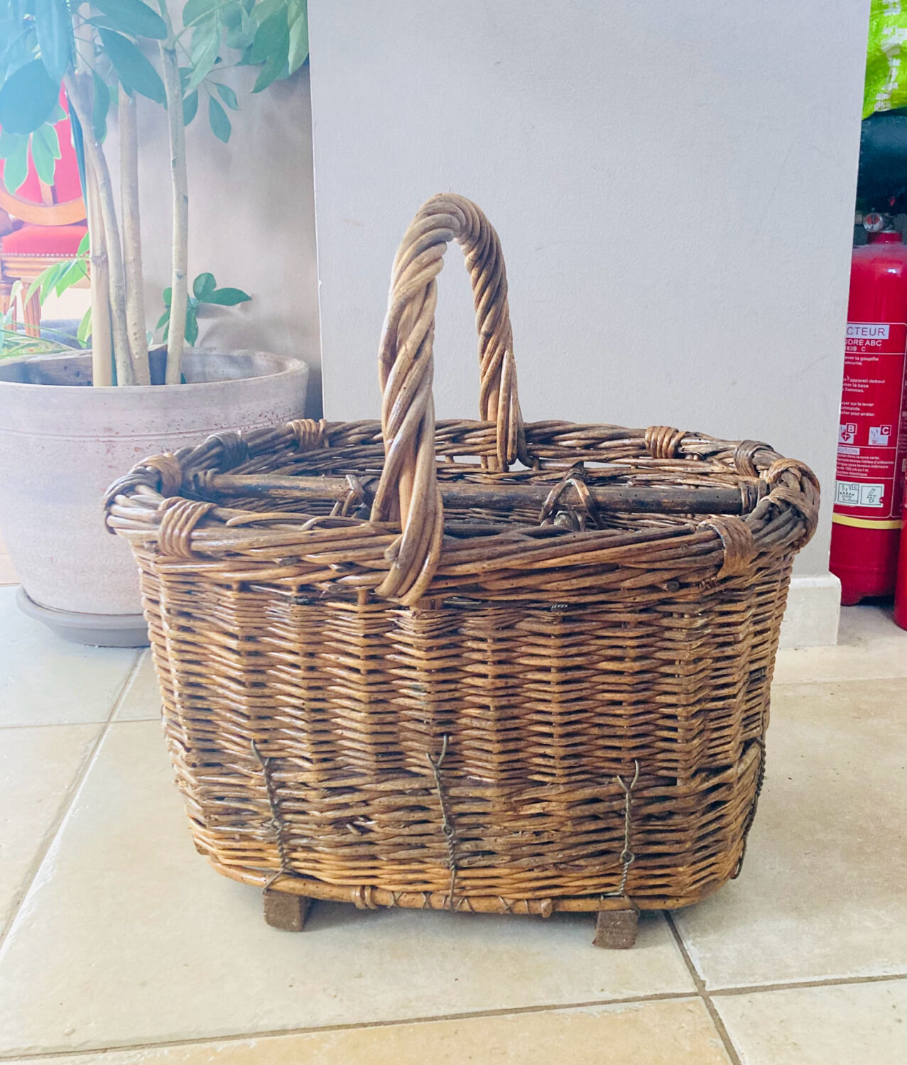 Wicker and hazel bottle basket from the early 20th century or possibly earlier.