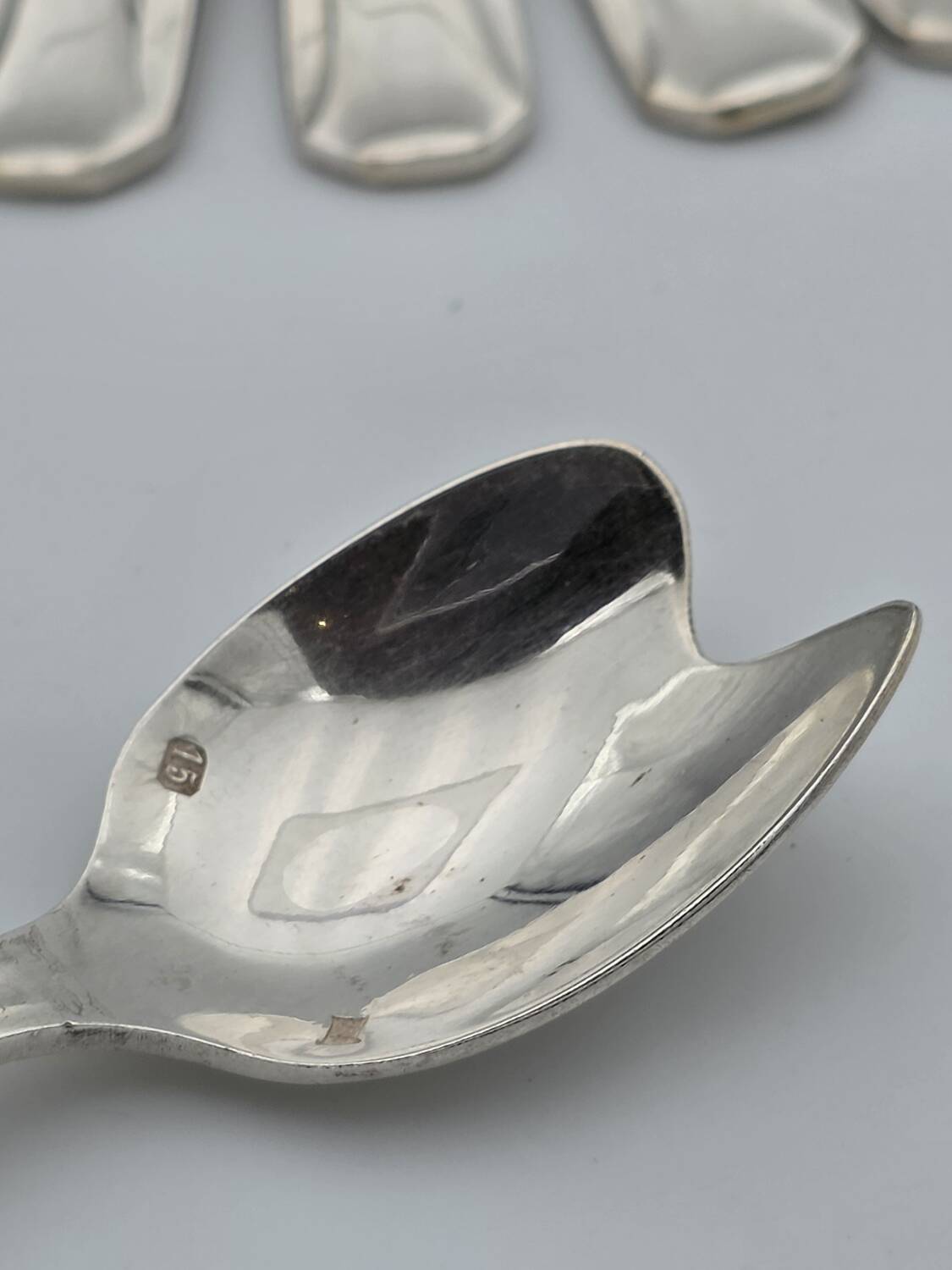 Set of twelve silver-plated metal spoons for oysters or sorbets