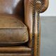 Sheepskin wing chair + XXL patinated footrest