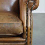Sheepskin wing chair + XXL patinated footrest