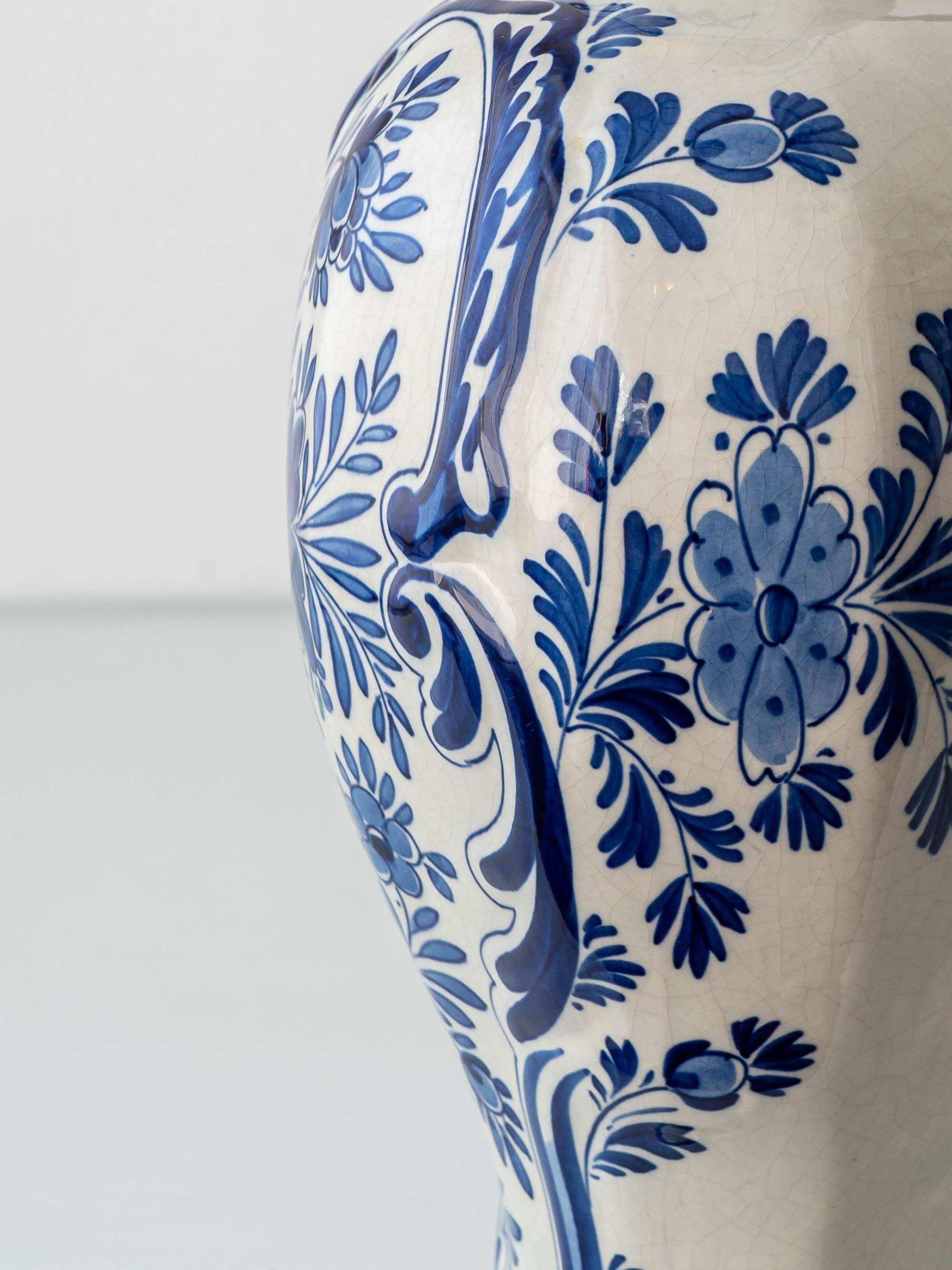 Pair of Royal Delft blue and white ceramic table lamps, 1905, with new pleated silk shades.