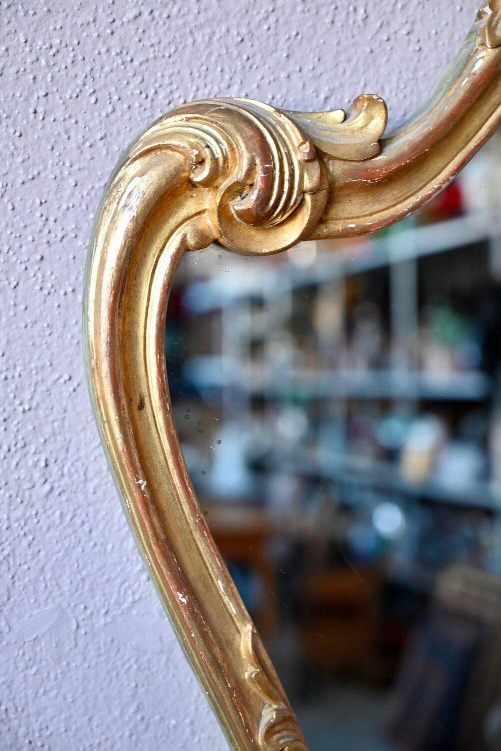Baroque gold table mirror in Louis XV style, carved and stuccoed wood.