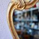 Baroque gold table mirror in Louis XV style, carved and stuccoed wood.