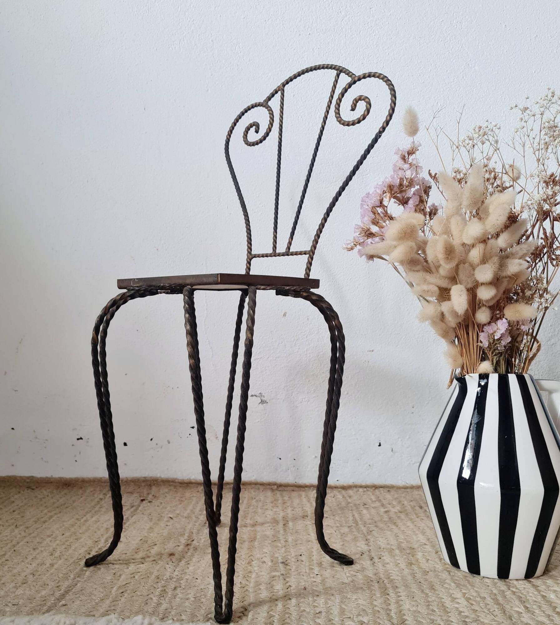 Small chair / stool in twisted wrought iron and floral ceramic.