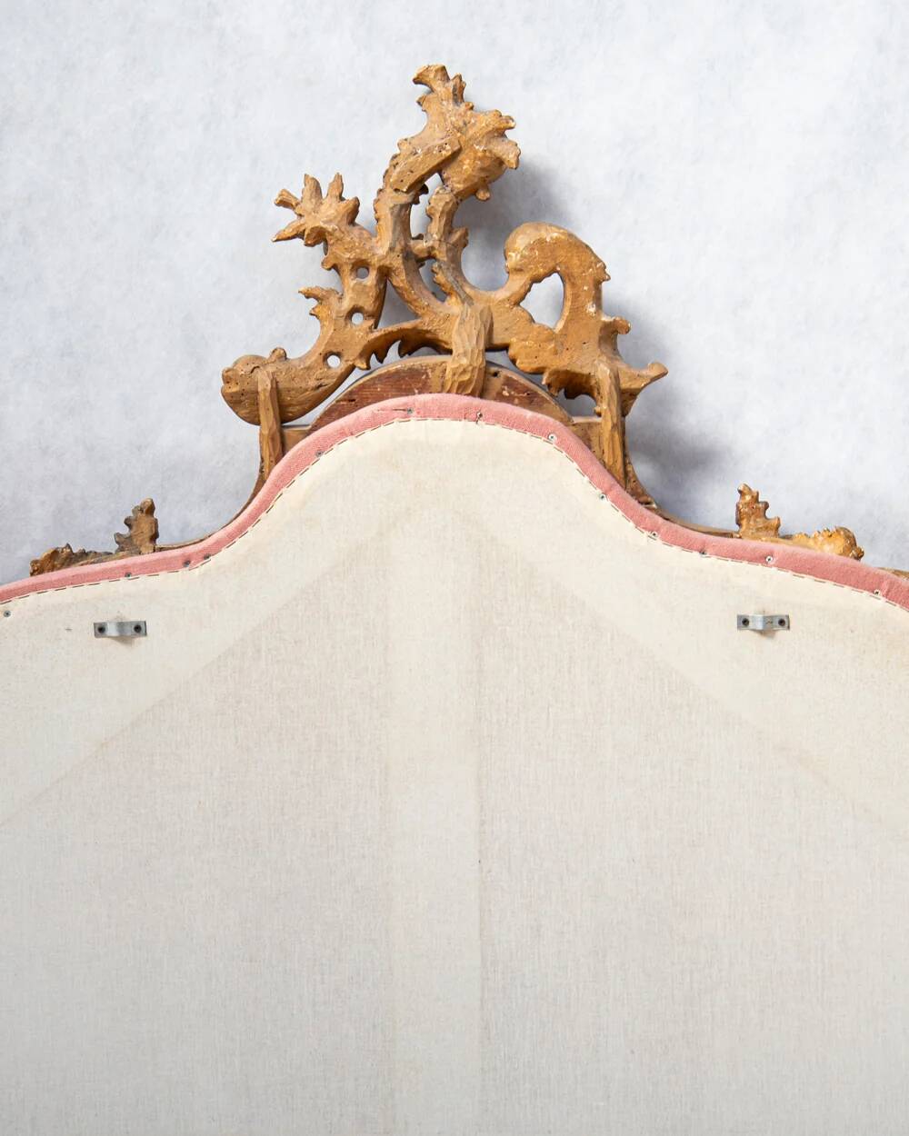 Italian rococo-style headboard in carved gilded wood, 19th century.