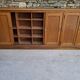 Oak workshop furniture with sliding doors.