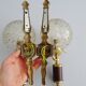 Golden wall lamps with round glass shades and teak veneer