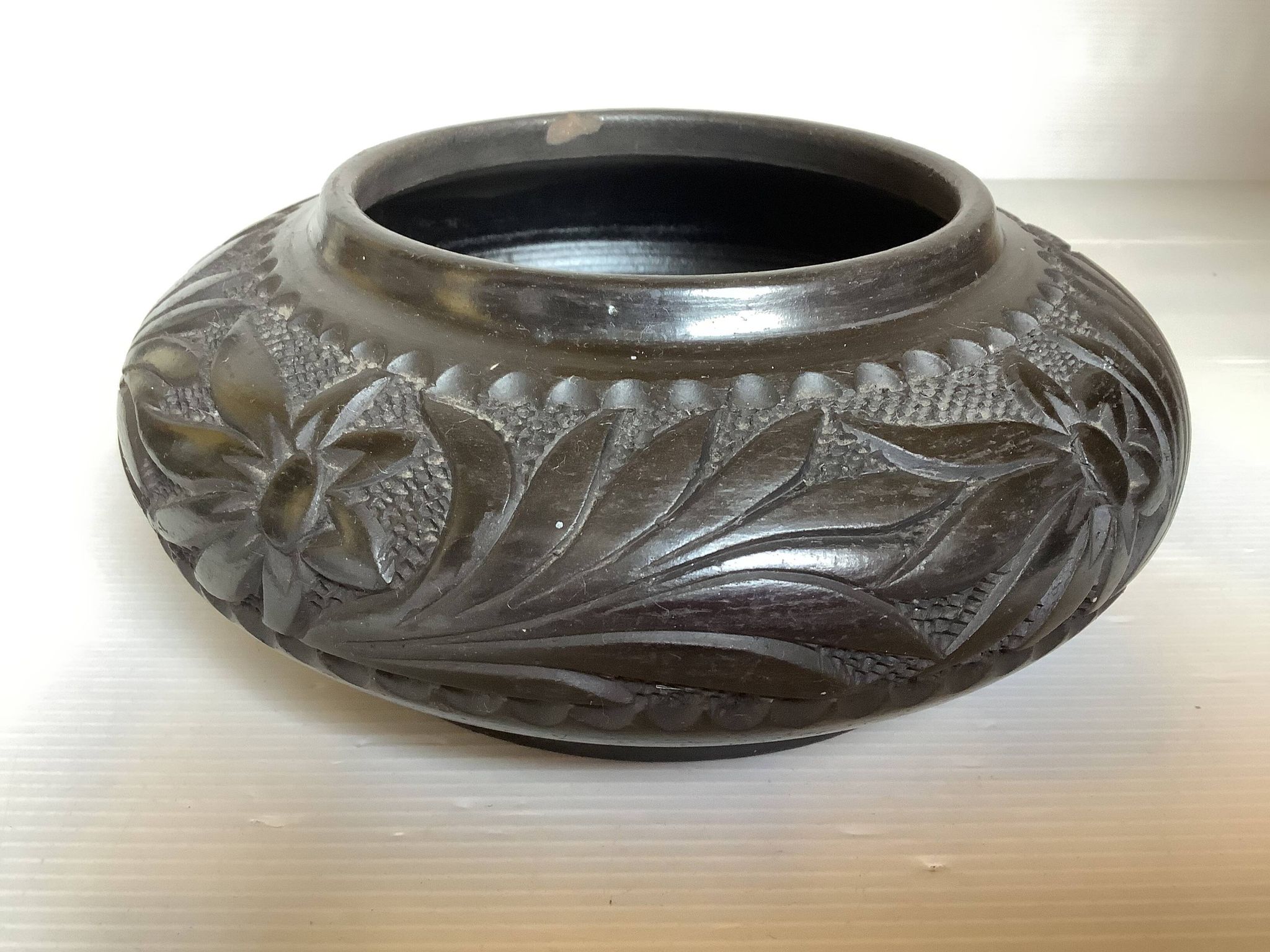 Black pottery catchall worked from Marginea, Romania.